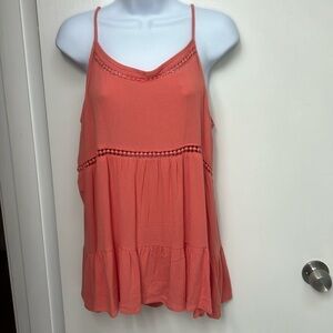 106. Paper Crane spaghetti straped top. Peach colored. 2 lines of circle cutouts
